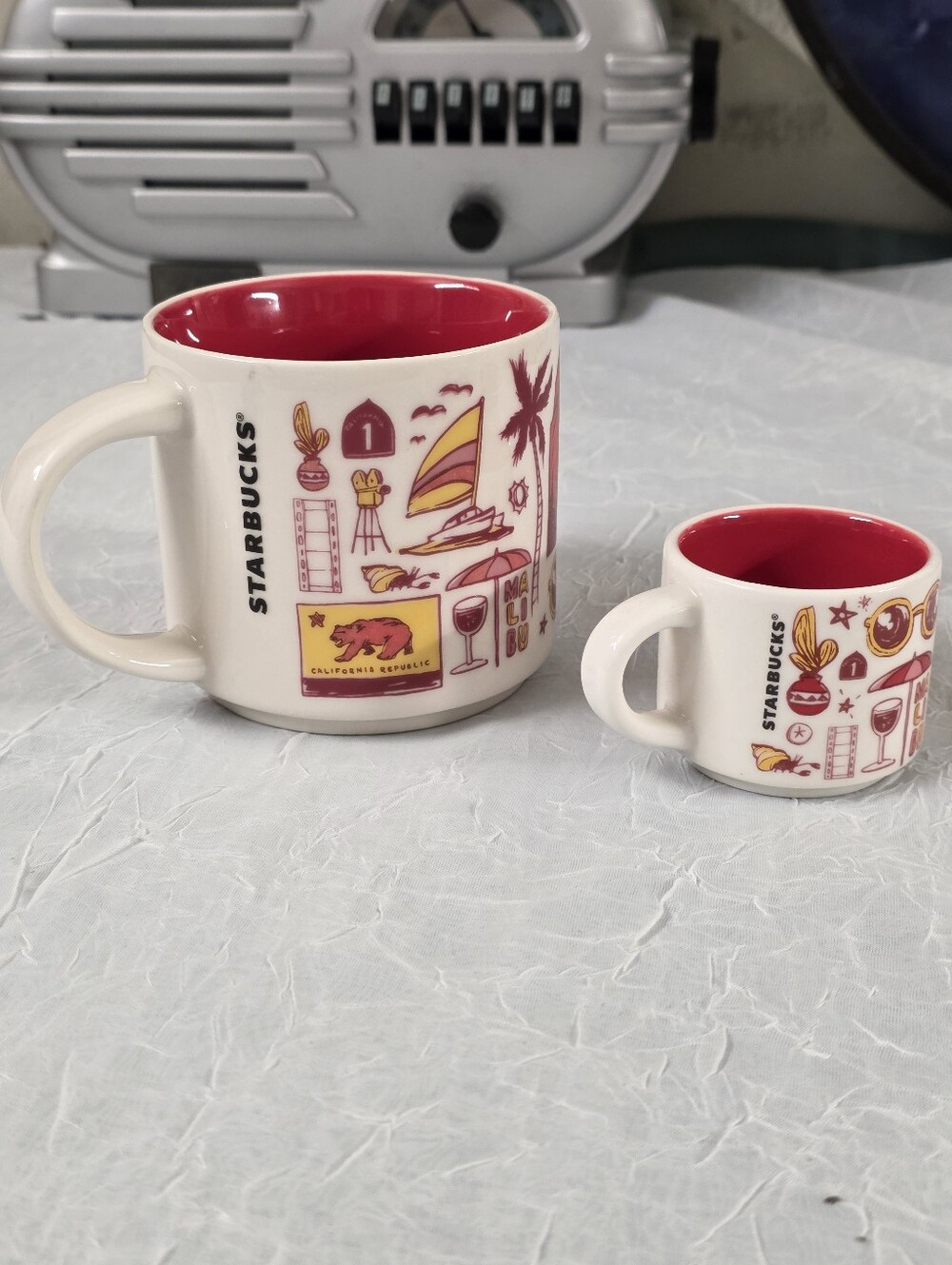 Starbucks White Ceramic Mug with Red Interior and Gold-Red Graphics